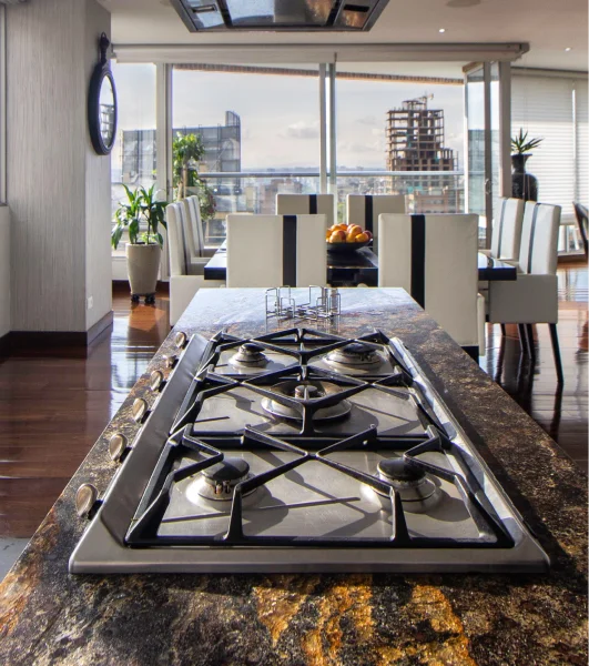 A kitchen with a stove top.
